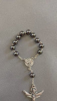 
              Peace & Protection Catholic Rosary Bracelet – Handmade Hematite Pocket Rosary with Holy Spirit Medal
            