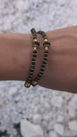 
              Elegant Womans Black Crystal Bead Bracelet With Gold Crucifix And Virgin Mary Medal Double Layered With Gold Accents
            