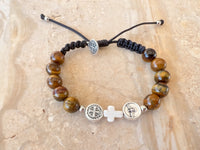 
              Tiger Eye Beads Bracelet With Coral Cross Charm And Saint Medals
            