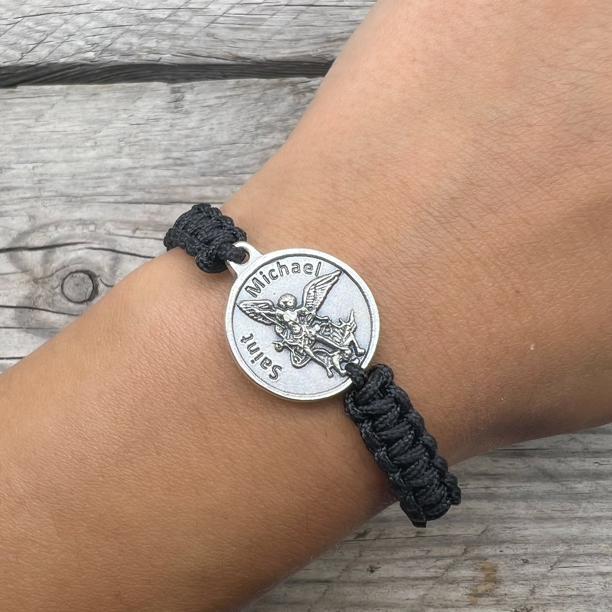 Amazon.com: Saint Michael and Guardian Angel Medal Bracelet on Woven Black  Cord | Adjustable | Christian Jewelry | Great Catholic Gift for First Holy  Communion and Confirmation: Clothing, Shoes & Jewelry